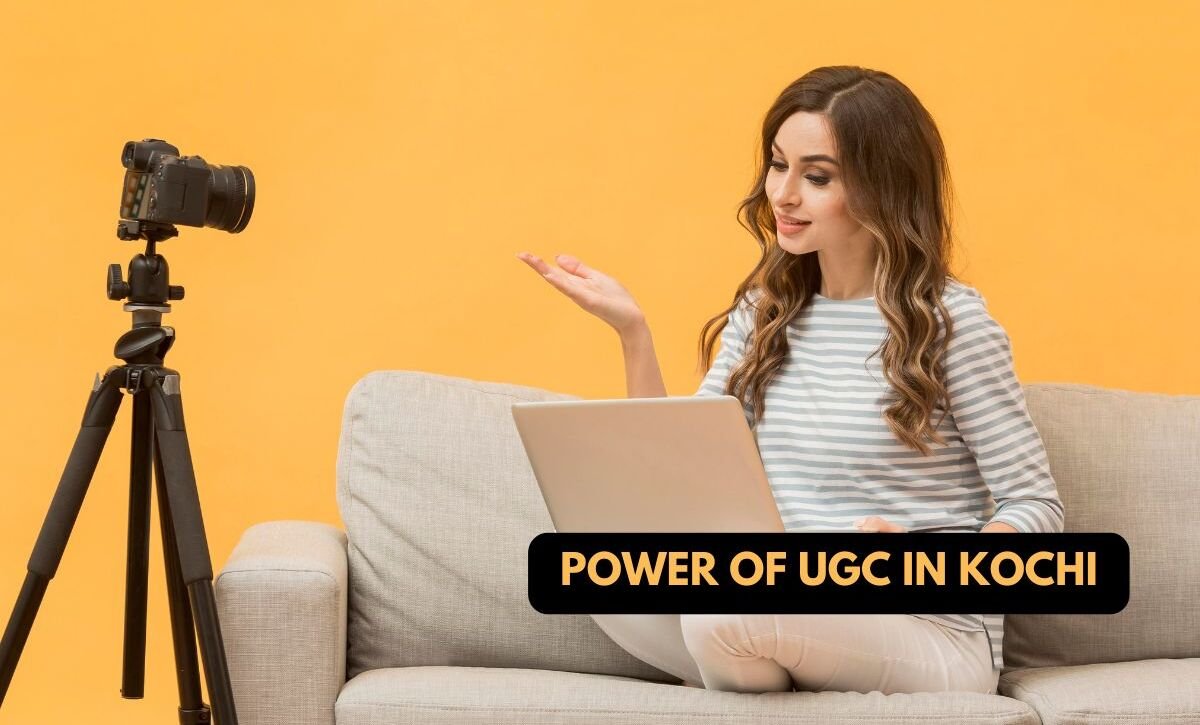 A woman sitting on a couch with a laptop, gesturing towards a camera on a tripod. The background is orange, and the text overlay reads "Power of UGC in Kochi." The image is credited to @upswingdigital.in.